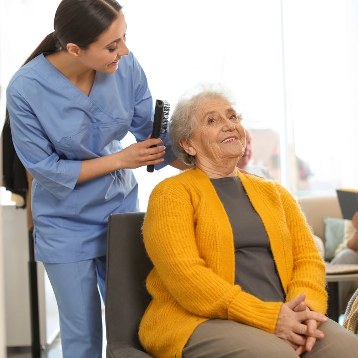Carer Assisting with Hair Styling Carer Assisting with Hair Styling